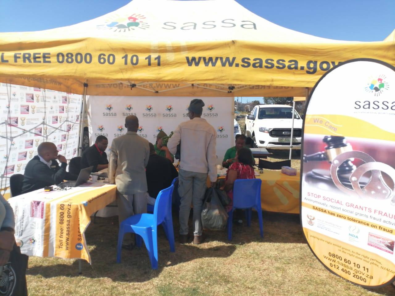 SASSA representatives assist people with June 2025 SRD grant applications at a mobile outreach tent, Apply for SASSA SRD Grant June 2025 Application
